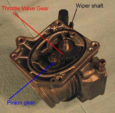 You have now exposed the lower geartrain, which transmits the rotation of the motor armature to the throttle valve.