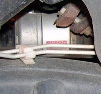 Leave brake lines attached to plastic clip for support.