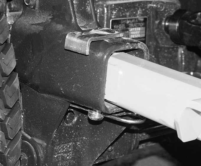 Figure 3-9 Locking pin Carrier arm WARNING: Before manipulating the tool bar make sure the power unit s engine has been shutoff, the park brake has been engaged and the