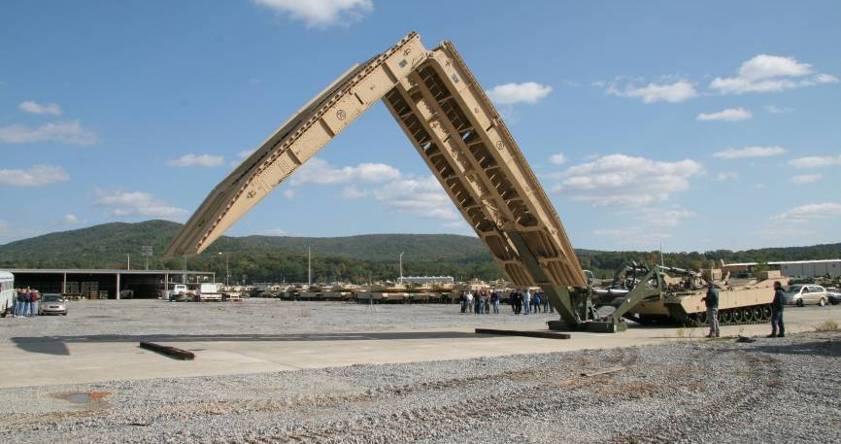 Joint Assault Bridge Description: Future assault bridging platform, designed to keep pace with the armored force; Consists of an M1A1 chassis, bridge launcher, and AVLB 70 bridge Specs: MLC 70, Span:
