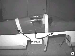 Trim the canopy along the indicated lines. Carefully position the canopy of the fuselage and tape in place.