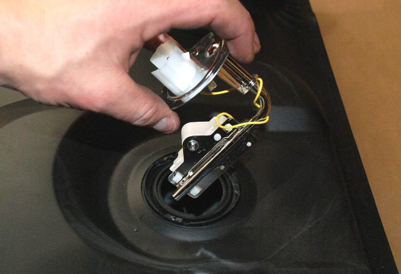 Make sure that the lock ring is held by all three locking tabs on the tank or the sender