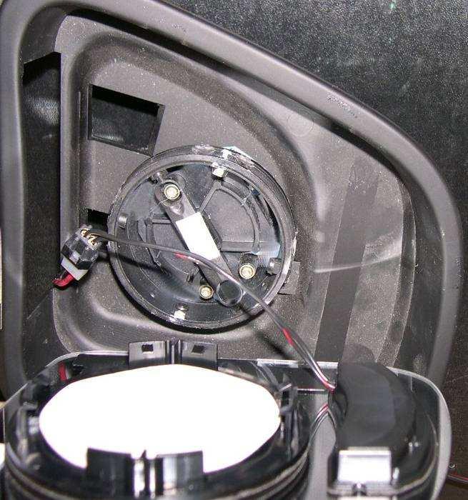 Remove Cap Sheet from twosided adhesive disc on back of Signal mirror and align the Signal mirror within the mirror housing. 9.