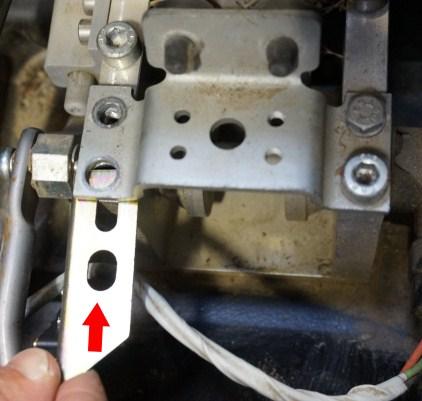 3. Slide the LGT-161 brake switch bracket under the original stop bracket on the driver side. The wires should face the rear.