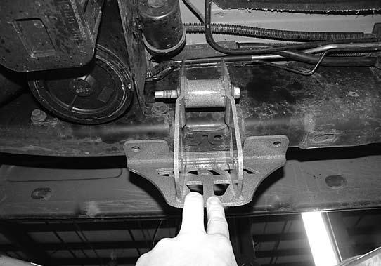 Install compression strut bracket (01242) onto end of compression strut with 7/16 hardware. Tabs face towards inside of vehicle.