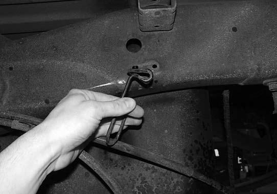 Remove the brackets from the compression struts and install the brackets with nut tabs (insert through large holes in the crossmember) (01248) and 7/16 x 1-1/4 bolts and washers.