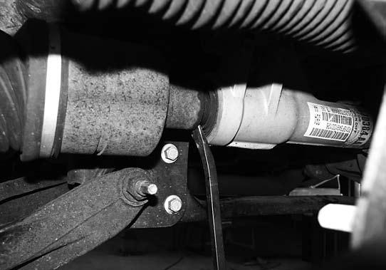 25. Locate the exhaust crossover pipe. If the crossover pipe runs under the front driveshaft it must be modified (Fig 6).