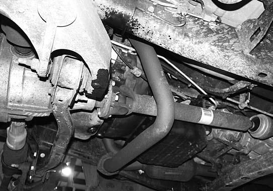 Take care not to damage the ball joint. Remove the upper ball joint nut and allow the knuckle/cv axle and lower control arm to swing down while sliding the CV axle off of the differential.