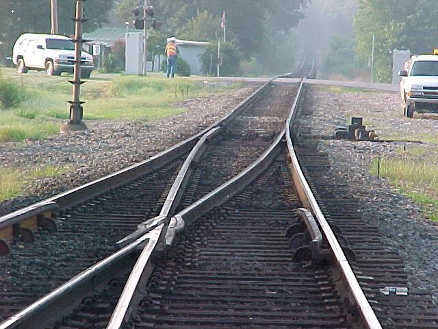 A slightly worn point will allow wheel-to-stock rail contact while the edge of the wheel is still over the middle of the stock rail.