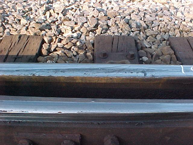 The stock rail did not its running surface through the transition zone was deformed, suggesting that the switch point had worn down relative to the stock rail, and that some worn wheels were