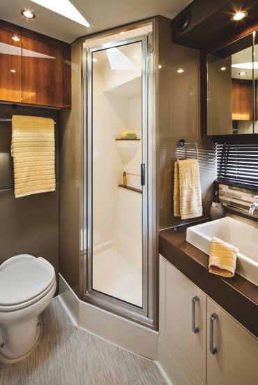 amenities include a queen-size island berth, port and starboard overhead lockers, hanging lockers, and dual end tables.