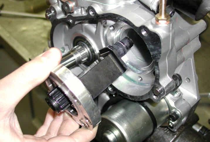 - EXTRACT THE BEARING SUPPORT BY PUSHING COUNTER CRANKSHAFT FROM THE SIDE OF THE WATER PUMP (see Fig.28). Fig.28 PAY ATTENTION NOT TO DAMAGE THE OIL SEAL LIP 11.