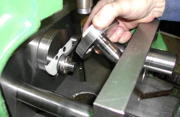 8. PLACE CLAMP JIG IN HORIZONTAL POSITION AND PLACE HALF CRANKSHAFT