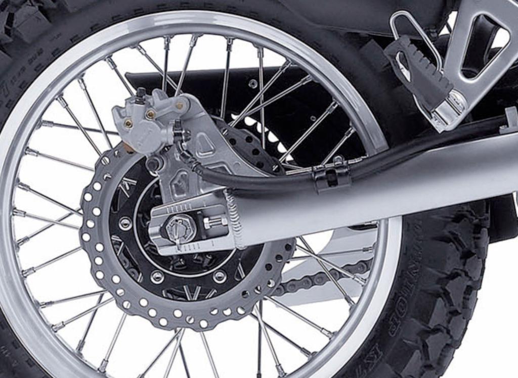(Photo 10) * Rear shock features 5-way spring preload and stepless rebound damping adjustability.