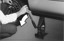 11. Tighten the wheel nuts firmly in a crisscross sequence as shown. 10. Lower the vehicle by turning the wheel wrench counterclockwise.