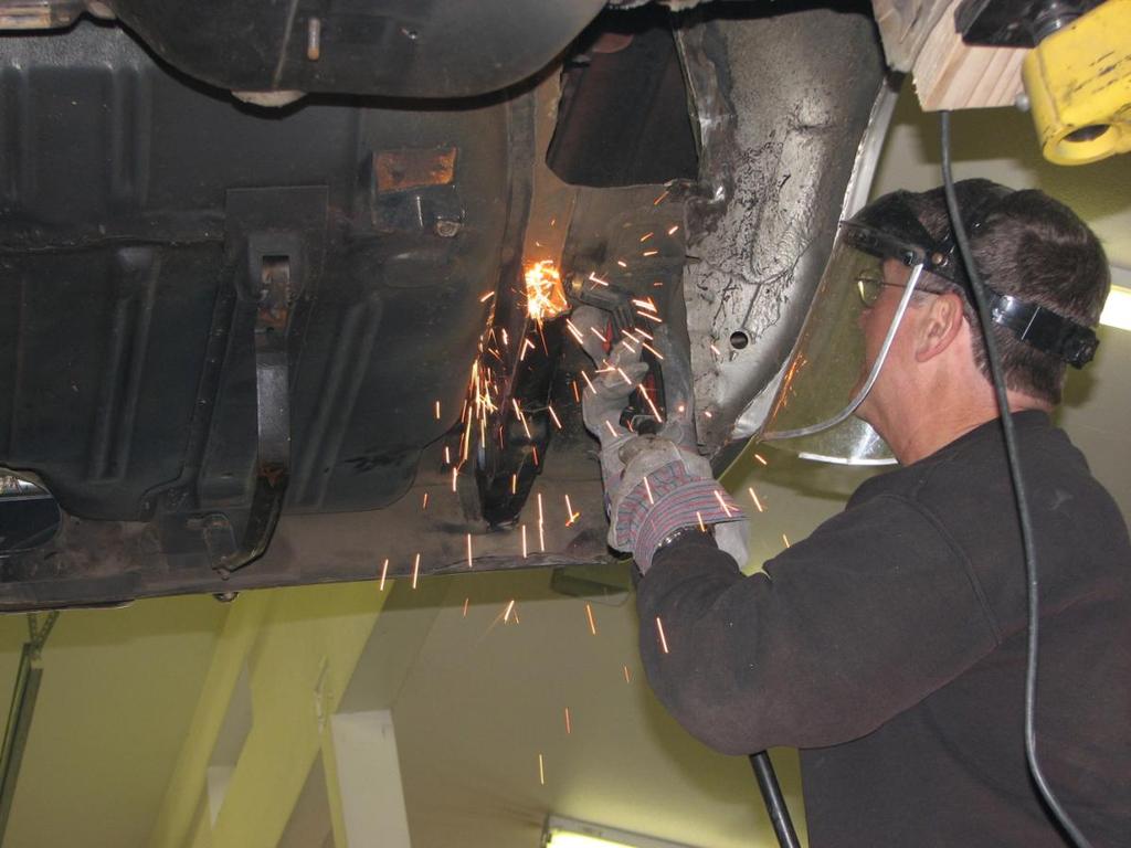 (Photo 1) Rail Removal: In this example, the frame rail is cut at the top radius using a plasma cutter.