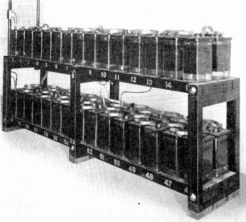 Storage Batteries. Construction, Plates. 3 Fig. 1. This photo shows a large group of lead plate storage cells in glass jars.