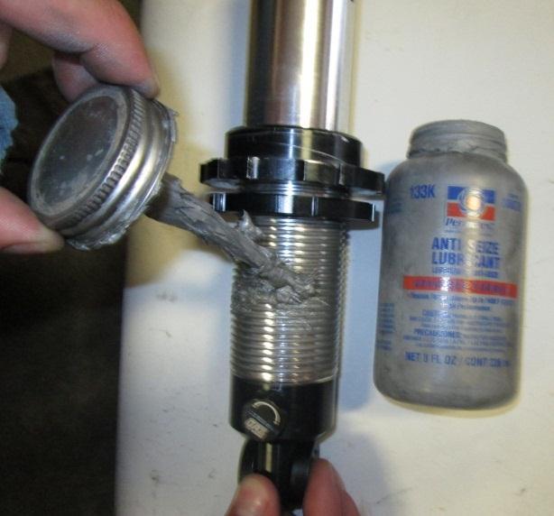 Failure to lubricate the coil-over threads with Anti-Seize prior to making ride height adjustments will cause damage to your shock absorber and will void any warranty.