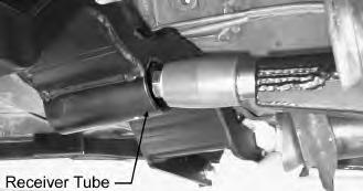 14. The TA Crossmember may now be slid rearwards while inserting the Urethane Pivot Bolt Assembly into the TA