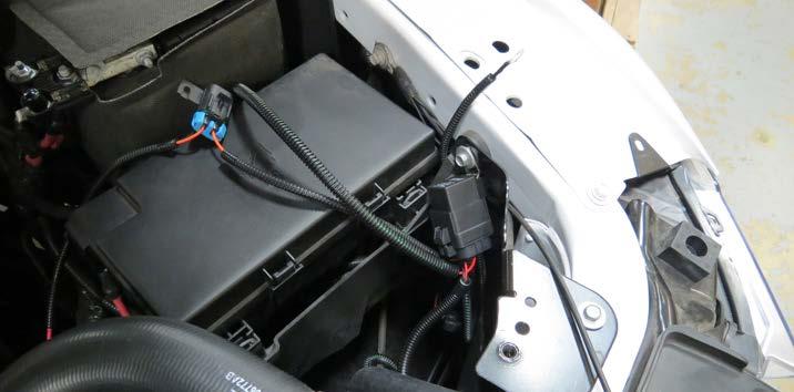 A good location is the bolt securing the fuse box assembly.