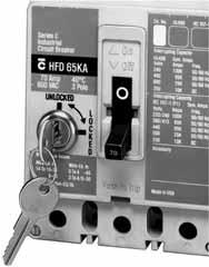 ) The hasp mounts on the circuit breaker cover within the trimline. The cover is predrilled on both sides of the operating handle so that the hasp can be mounted on either side of the handle.
