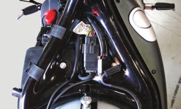 the frame tube to the area under the seat (Fig. B). FIG.