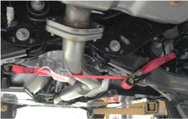 1. Support and lower exhaust: Lower the exhaust by removing