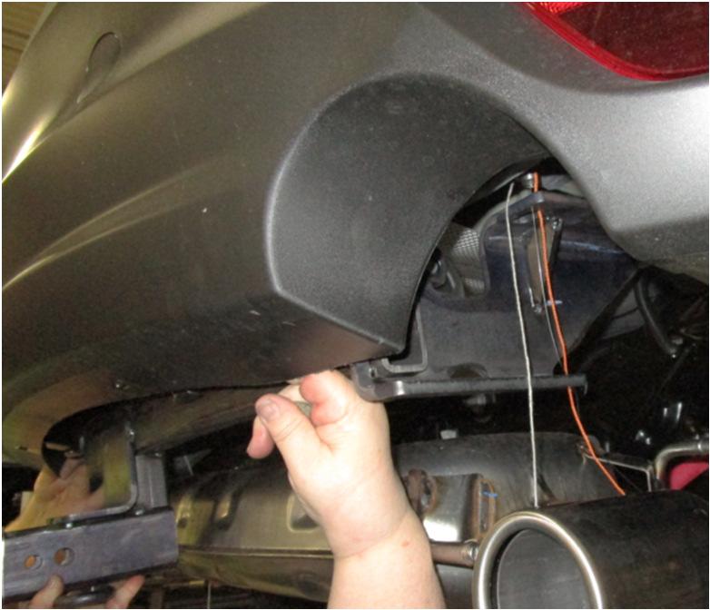 4. Install hitch: Raise the hitch above exhaust,