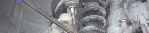 install the upper strut nut and