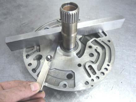 Place a precision straight edge across the machined face of the pump cover. Try to install a.