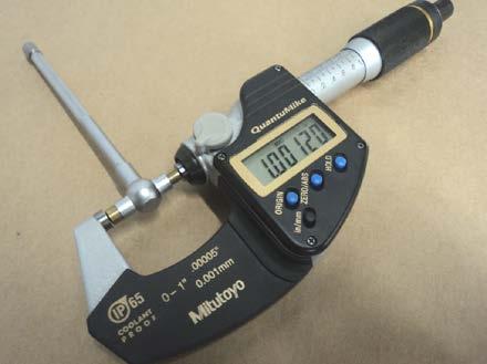 Carefully set a bore gage to the inside diameter of each bushing. See Figures 10A-36 and 10A-37. Use a micrometer to measure the gage. See Figure 10A-38.