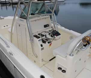 insulated coffin fishbox with Suzuki 175 or 225hp motors overboard drain > Extended swim platform with integrated > (2) 240-quart insulated forward deck handrails and ladder fishboxes with macerators