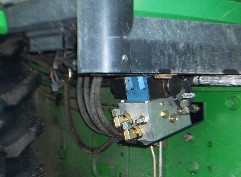 cab in the position shown below using the existing tractor bolts.