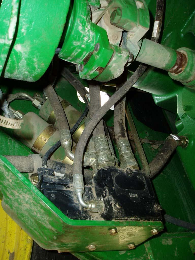 3 Connect to the JD Valve Locate the JD electrohydraulic steering valve directly below the steering unit
