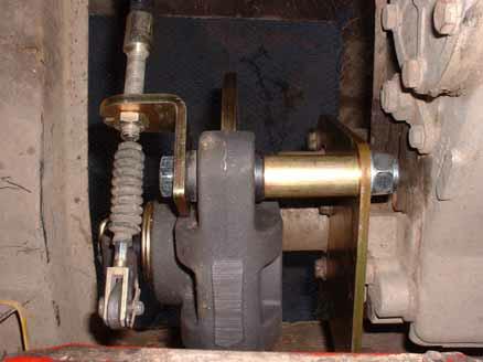 Now pass the remaining M16 bolt through the angle bracket and through the calliper. Hold the second spacer tube between the rear of the calliper and the back plate.
