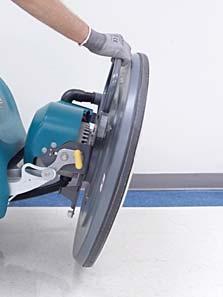 2. Step down and to the left on the burnishing head lift pedal to raise head off floor (Figure 4).