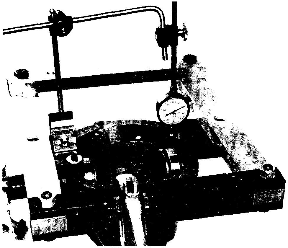Figure 18 1021-18 Mount spreader with adapter blocks and holddown screws to carrier as shown. Do not spread carrier over.020" (.50mm). Use dial indicator as shown.