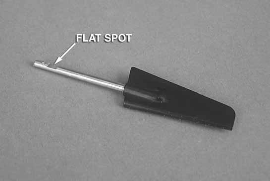 Using the included allen wrench, tighten the set screw located on the lower left side of the rudder.