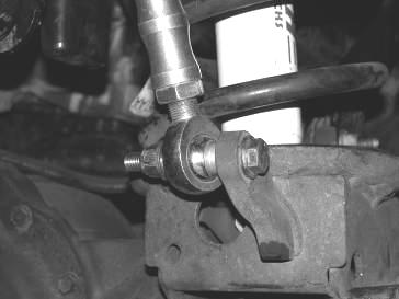 Connect the track bar to the new drop bracket using the supplied 9/16 x 3 bolt, nut, and washers,(2008-2010 model trucks will need the two 9/16 holes in the track bar bracket drilled out to 5/8 as