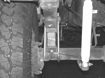 Using the supplied u-bolts, nuts and washers, from the Coil Spring box, align axle, lift block, and springs and torque to u-bolts to 90 ft-lbs.