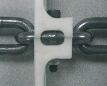 using a standard bolt and nut, connecting the