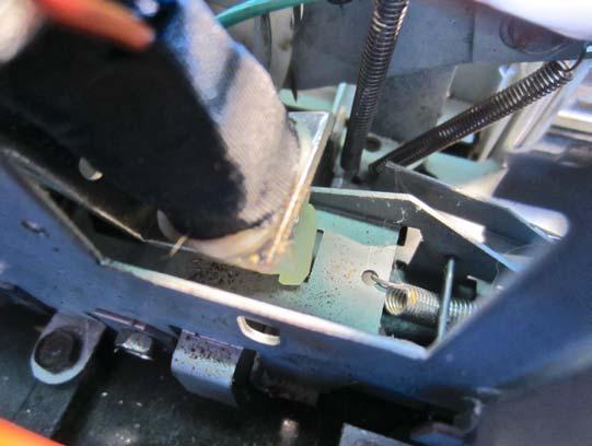 Using a dull tool, one with no sharp edges that will cut or nick the plastic, and work the plastic end into the slot until the two cutouts engage with the sides of the slot.