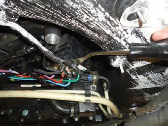 4. Remove the wiring harness clips from