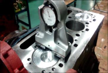 A. Method currently used The conventional method of piston topping is by means of a depth gauge as shown in the figure.