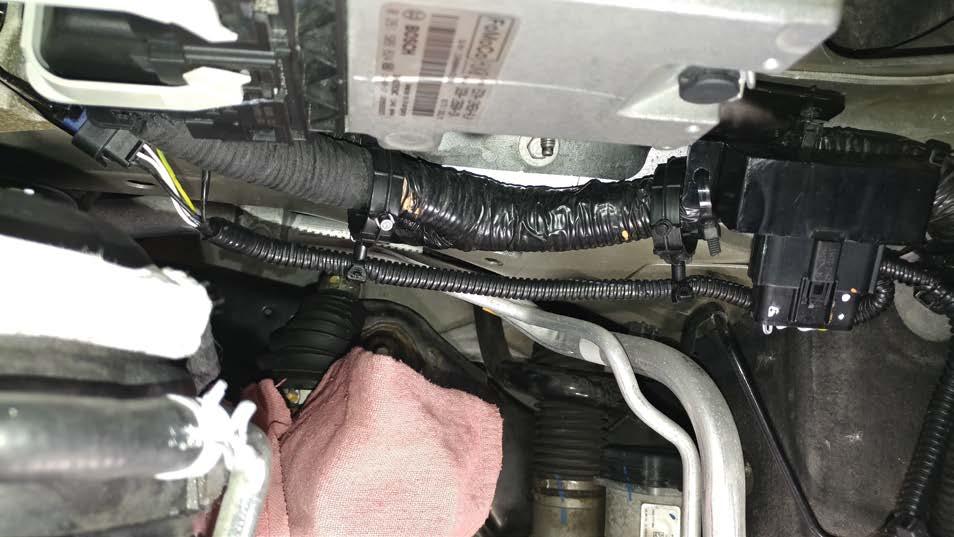 PAGE 16 OF 45 4. Route the coolant stand-pipe wire harness stand pipe electrical connector and ground eyelet wire along the lower PCM connector wire harness.