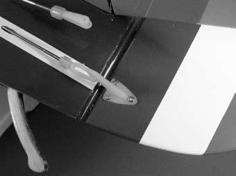 Use a felt-tipped pen to transfer the mounting holes onto the rudder.