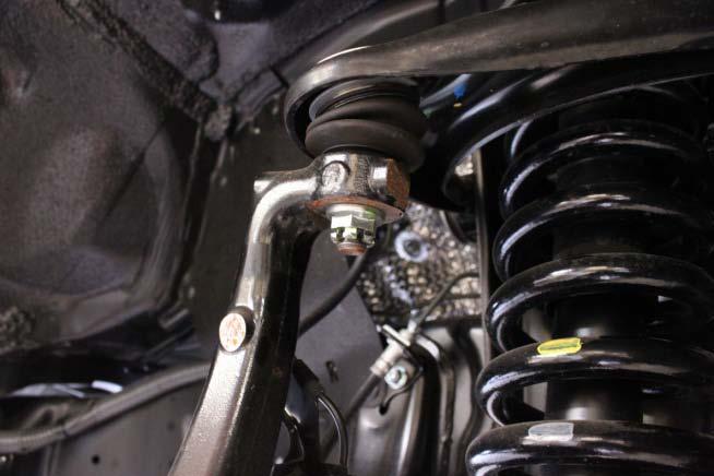 Install the lower strut mounting bolt and nut, torque to factory specs, use thread locker if necessary. 10.