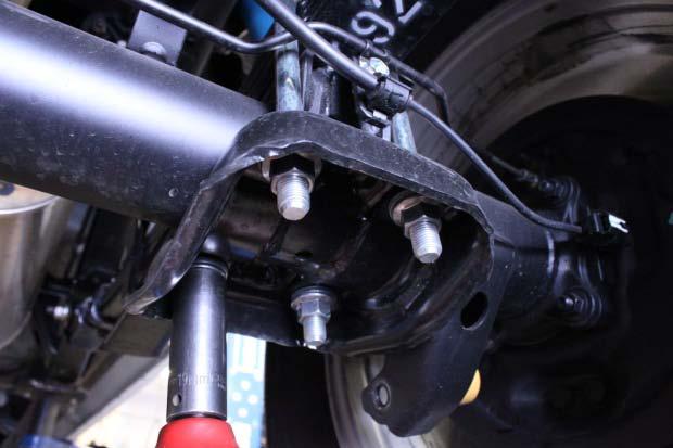 If you have jack stands, place them under the frame rails and lower 3.