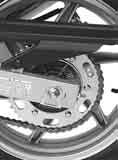 Loosen the drive chain adjuster right and left.