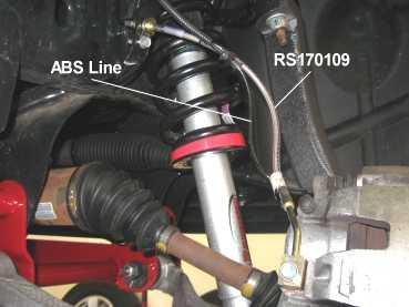 5) Attach right brake hose 170109 to the caliper with new washers and the original banjo bolt. See illustration 25. Tighten the bolt to 20 ft. lbs.